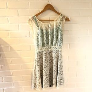 Homemade lace and multicolored under-slip dress with chunky zipper in back.